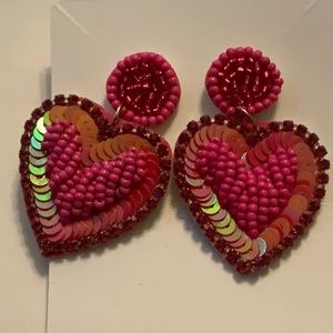 A pair of heart earrings